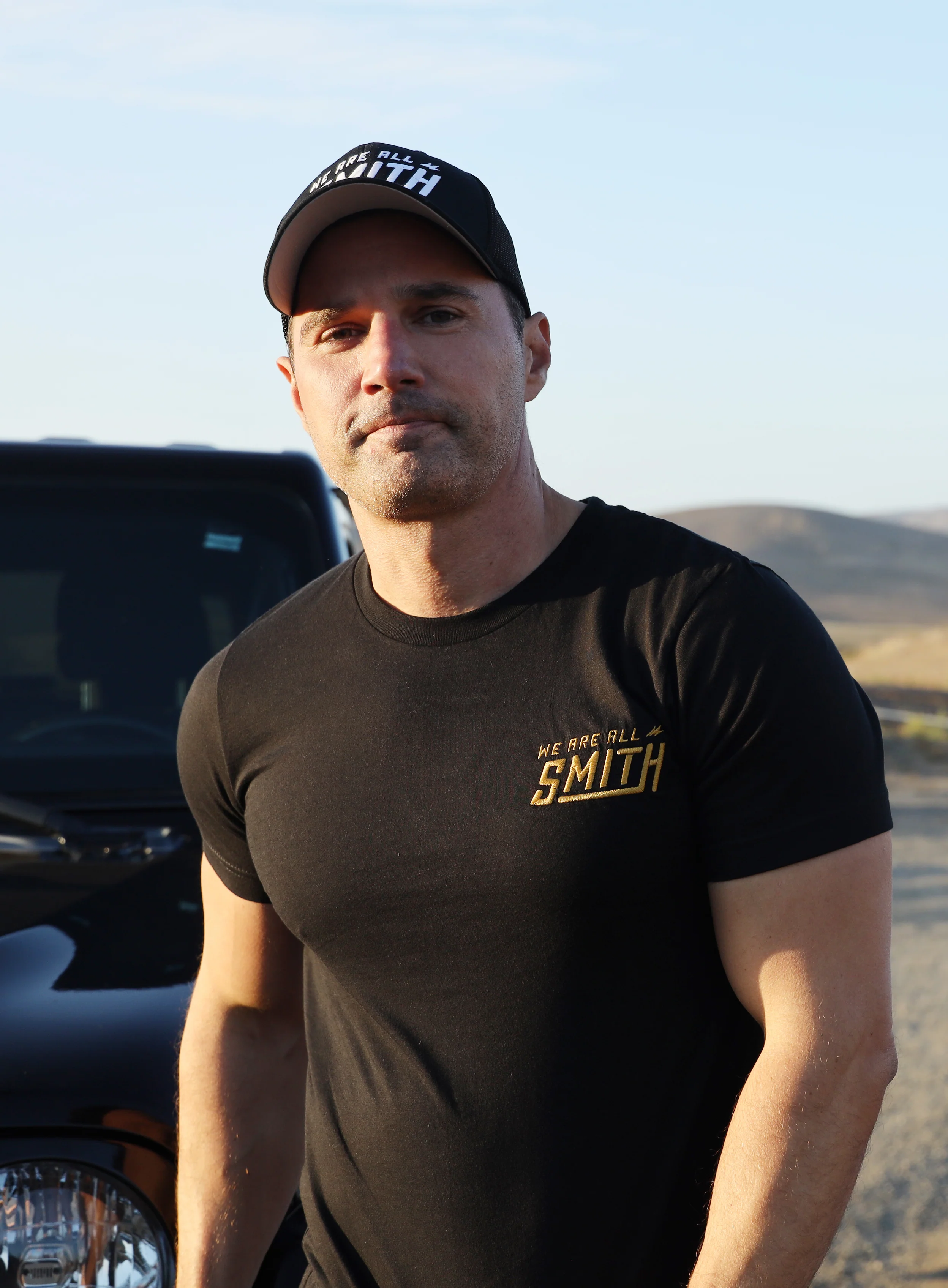 Gold We Are All Smith Embroidered Logo Black Unisex t-shirt - Image 2