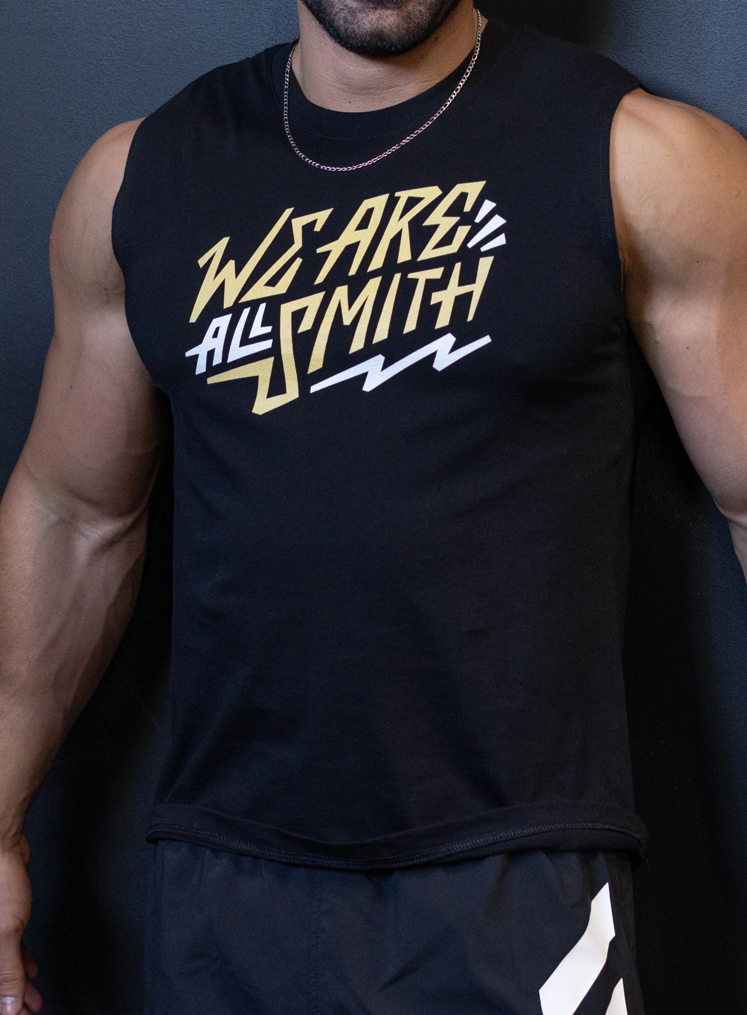 We Are All Smith Yellow Logo Black Muscle Shirt
